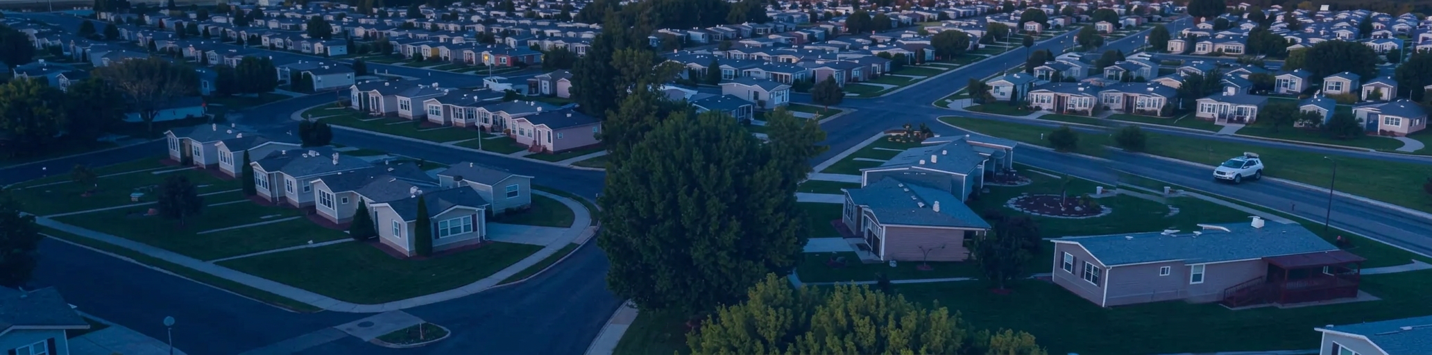 Aerial view of a manufactured home community at twilight